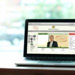 Laptop, notebook computer background, mock up display, with blank screen on wood table by window  business and technology, online education, technology lifestyle concept